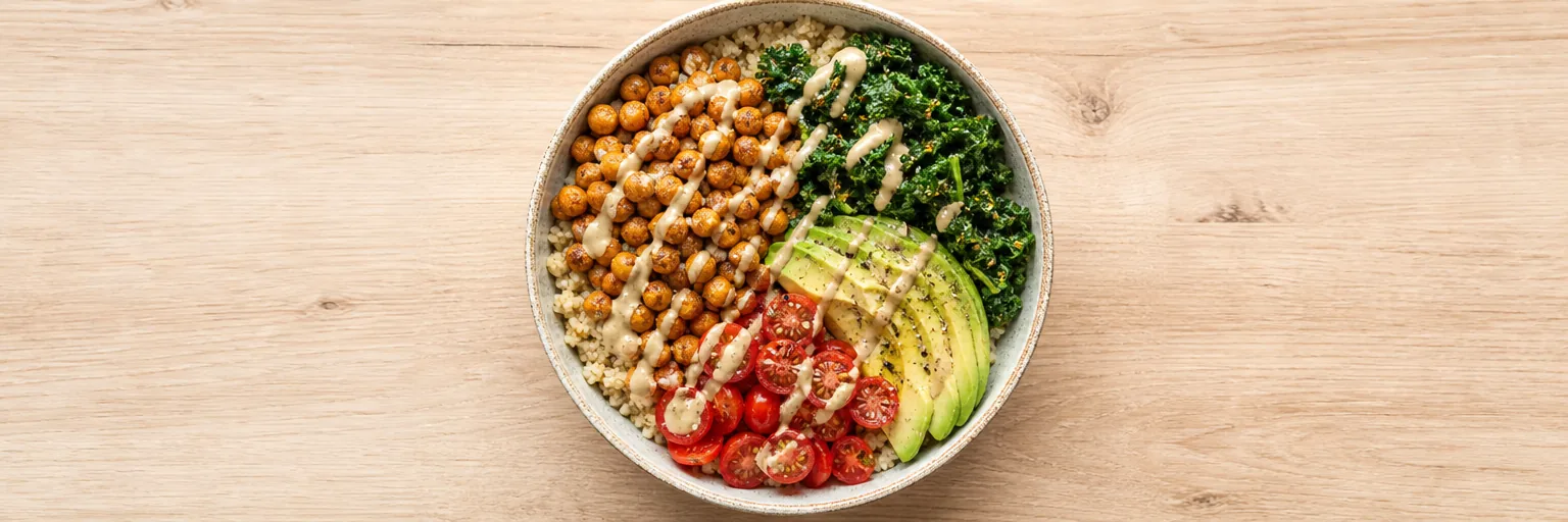 plant-based weight loss bowl with quinoa, chickpeas, kale, avocado, and tahini